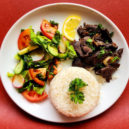 Beef Shawarma Plate - Tender marinated beef with rice, fresh salad, and sauce