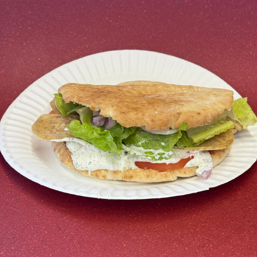 Chicken Gyro Sandwich - Tender sliced chicken with fresh lettuce and tzatziki sauce